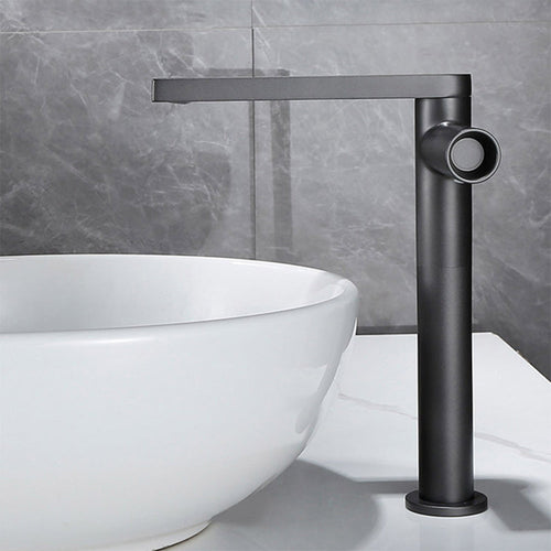 Gunmetal grey 360-degree swivel basin tap in the high configuration beside a round basin