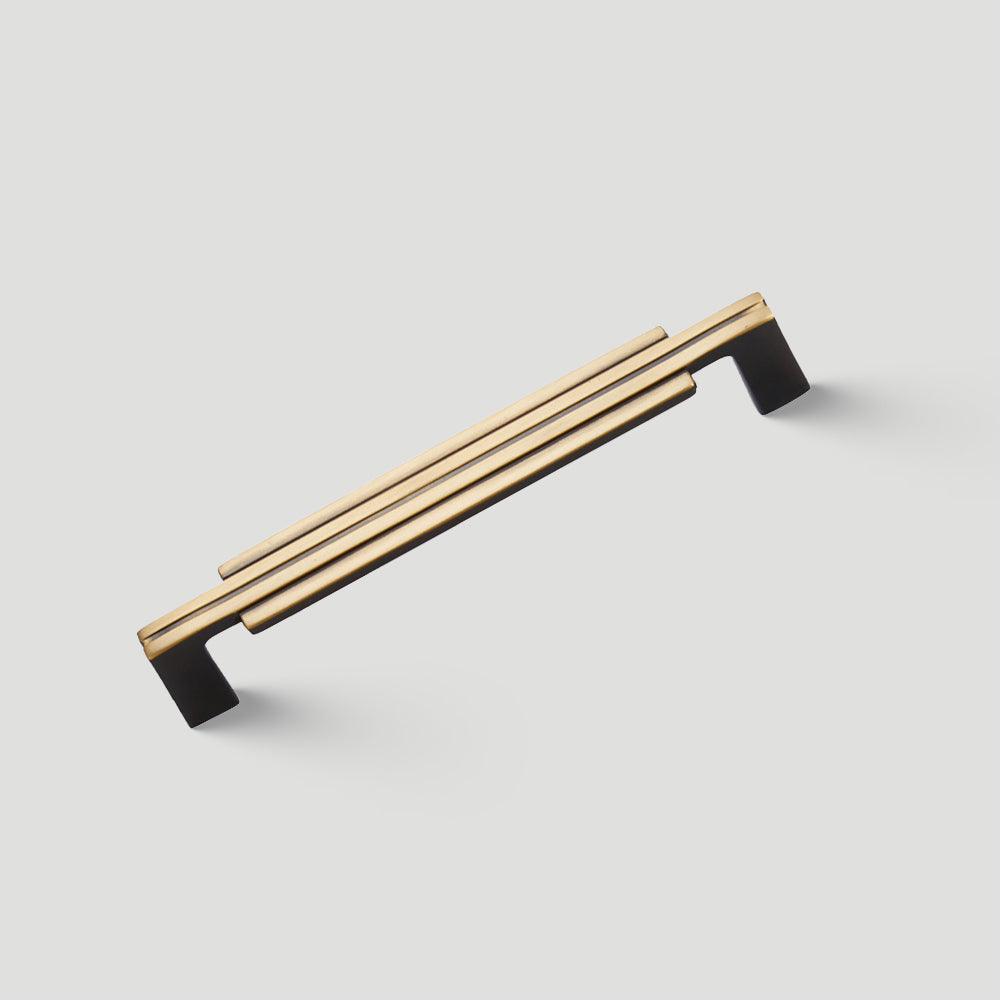 Art Deco brass cabinet hardware single gold pull handle on white