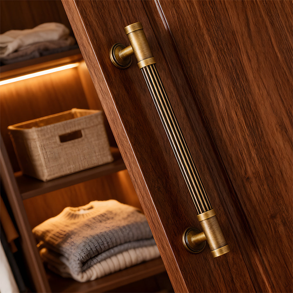 Striped antique bronze brass cabinet pulls installed on cupboards and drawers