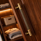 Striped antique bronze brass cabinet pulls installed on cupboards and drawers