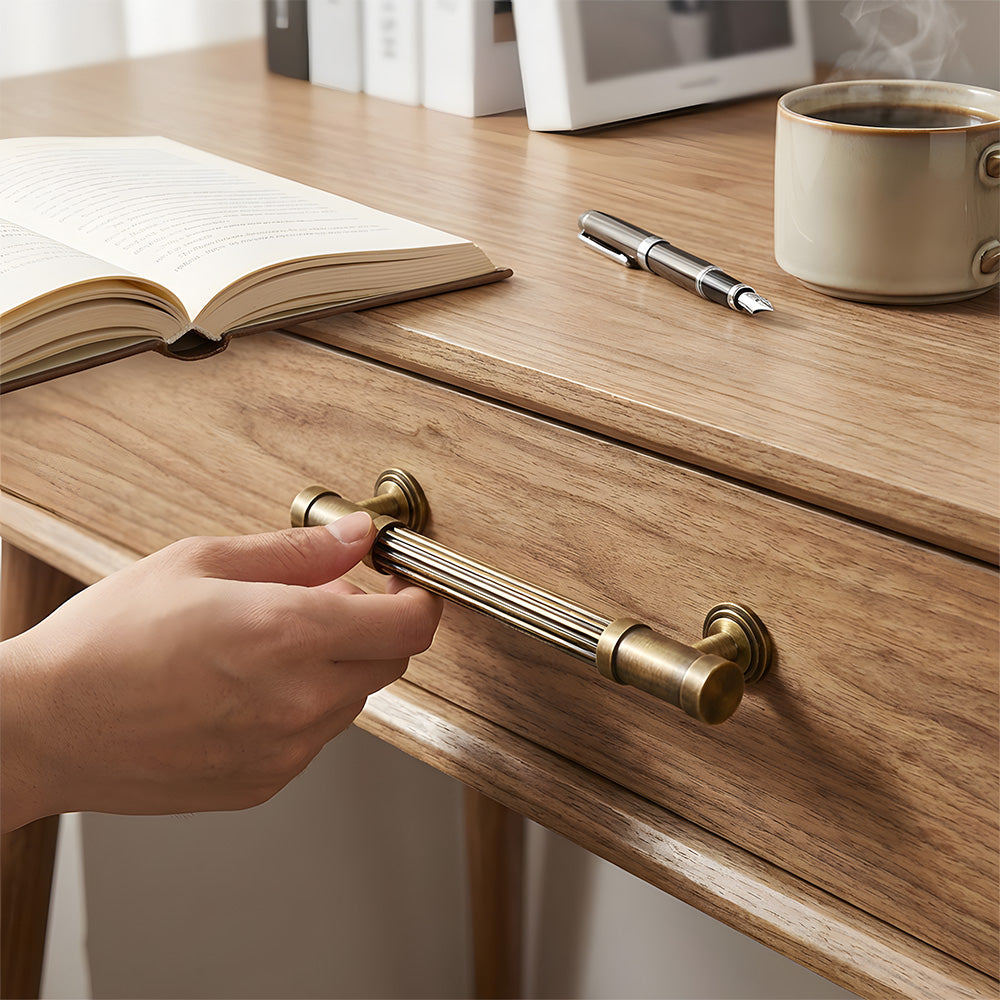 Striped antique bronze brass cabinet pulls installed on cupboards and drawers