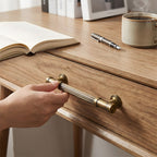 Striped antique bronze brass cabinet pulls installed on cupboards and drawers