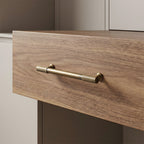 Antique bronze striped brass handle fitted to a light wood drawer
