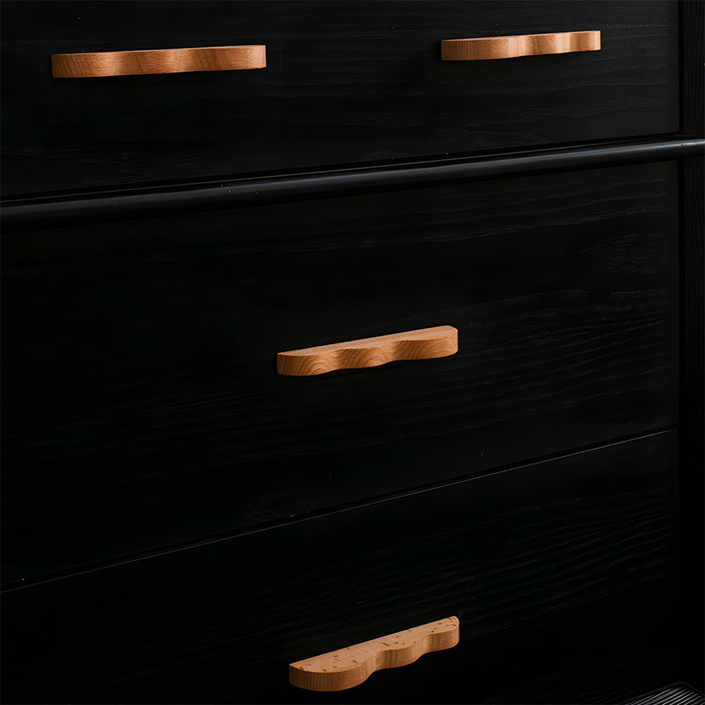 Wavy wood cabinet handle light wood handles fitted to black drawers