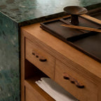 Wavy wood cabinet handle black walnut pulls on a wooden sideboard